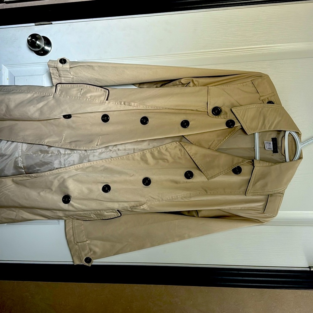 New. Never used VENUS trench coat.